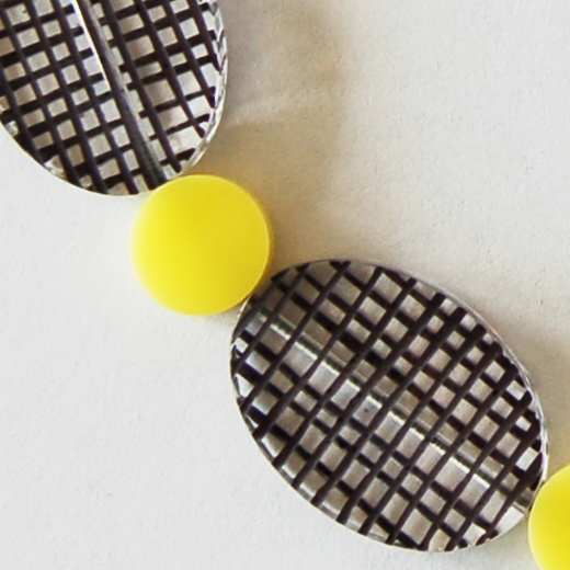 yellow spot colour necklace detail