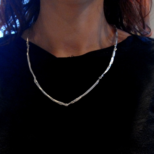 Strand necklace worn