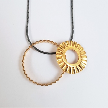Sunray pendant in silver with gold plating by Clara Breen