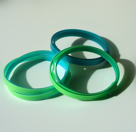 thin turquoise bangle shown with two other bangles